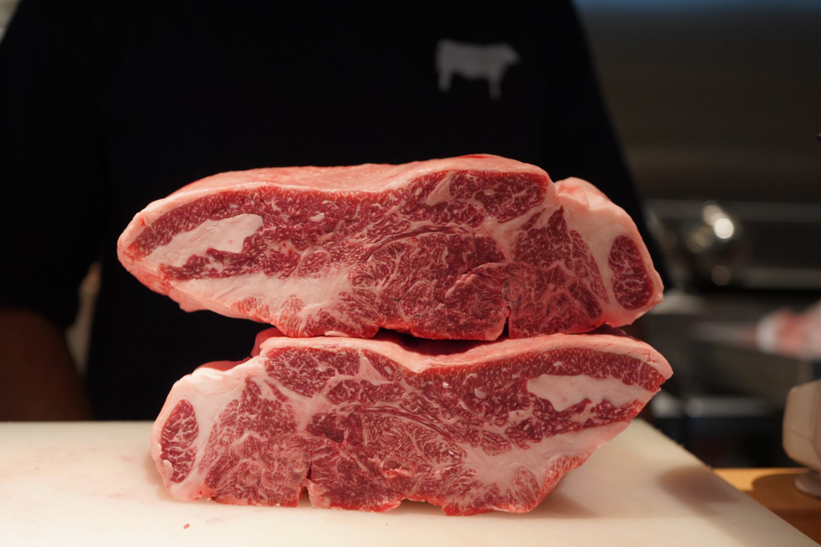 Raw, heavily marbled blocks of wagyu