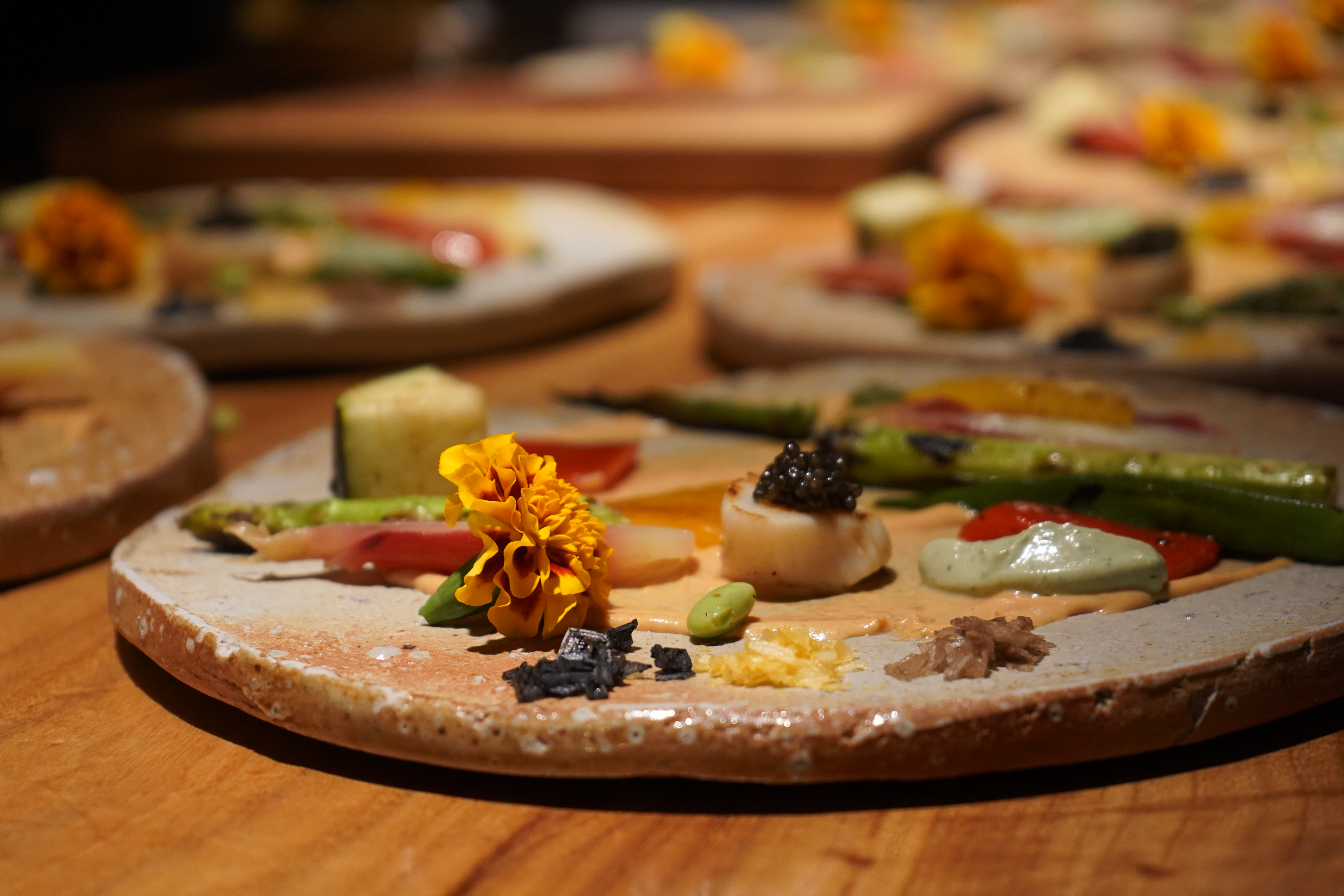 A plated course of grilled vegetables, scallop and caviar at Kitan Hibiki
